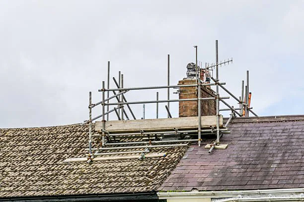 Independent chimney stack scaffold on a tiled roof